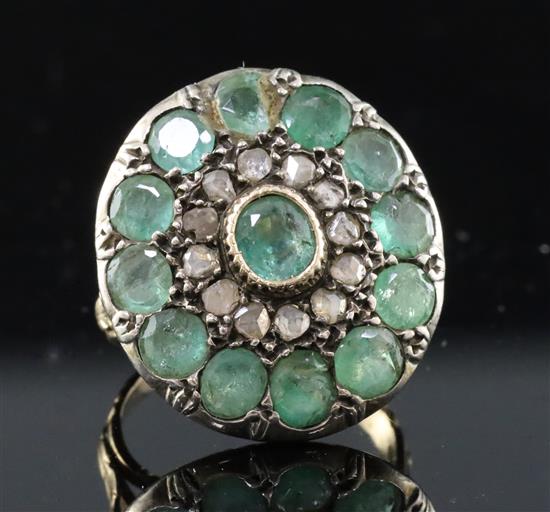 A 19th century style gold, emerald and rose cut diamond set target cluster dress ring, size H.